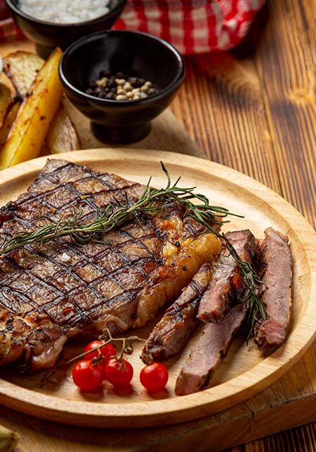 grilled-beef-steak-dark-wooden-surface grilled-beef-steak-dark-wooden-surface